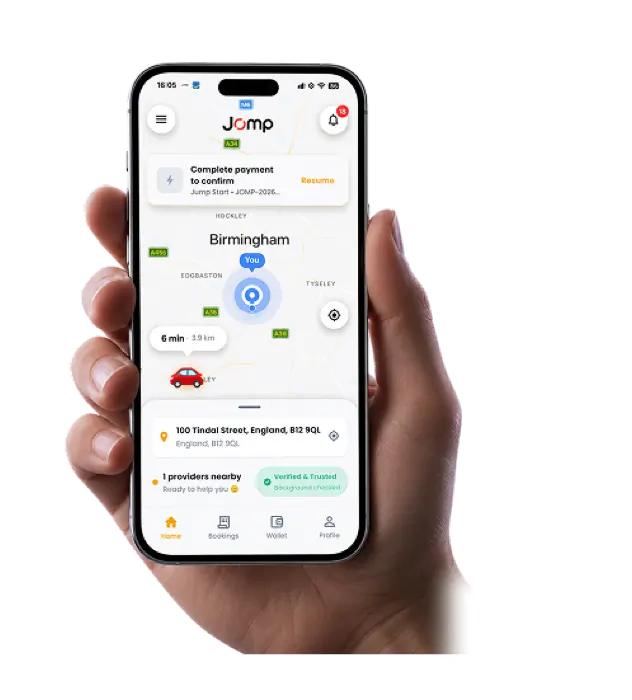 Hand holding smartphone showing JOMP app home screen